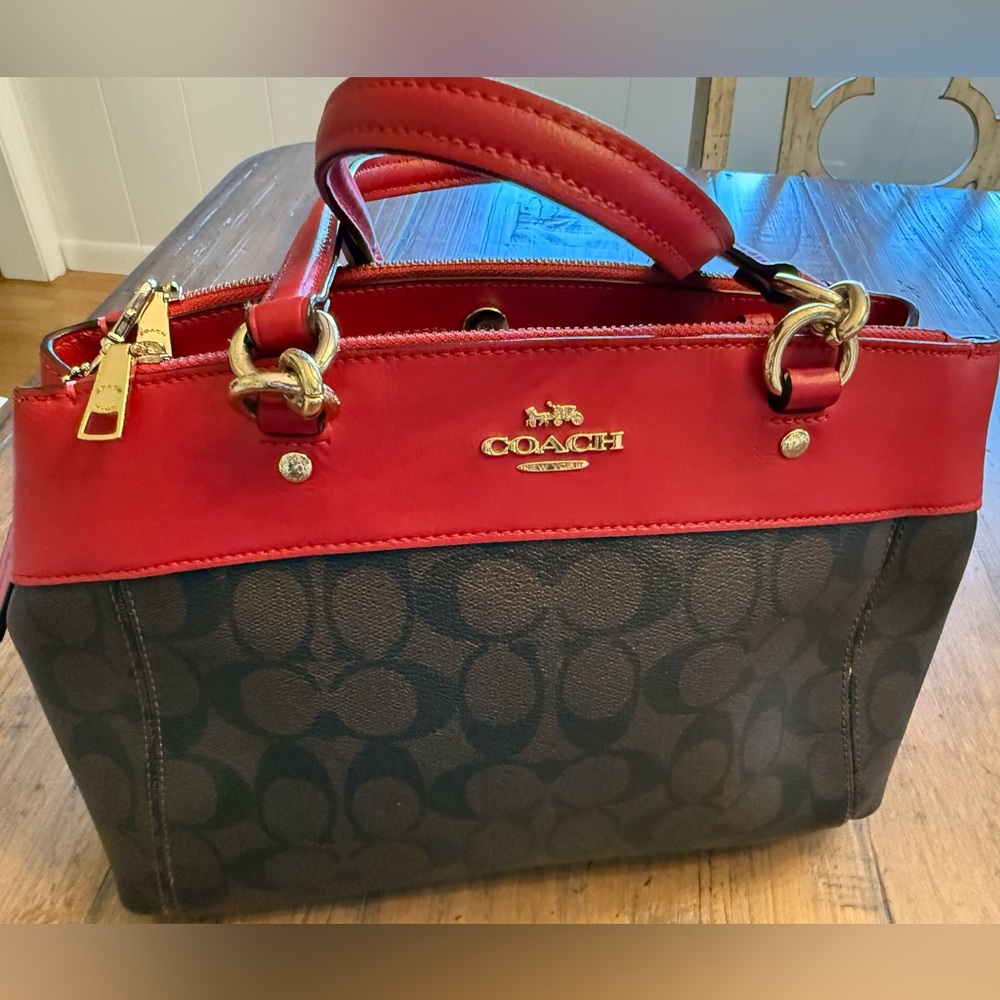 Coach Women's Signature Mini Brooke Carryall
Handbag red with brown signature.
